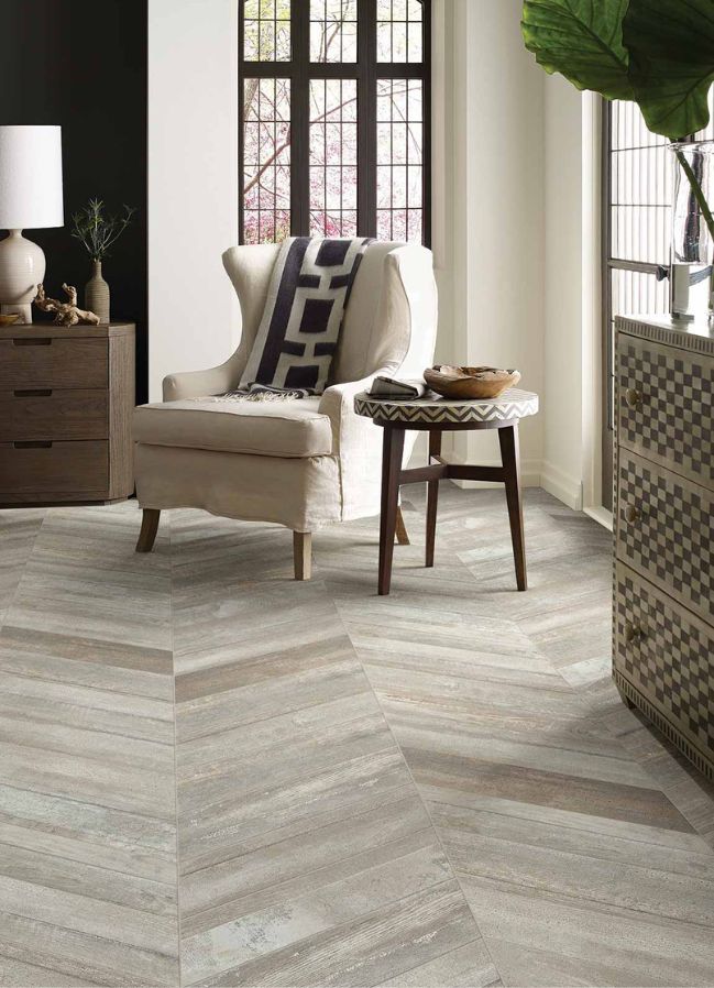 wood look tile floors in a cozy living room with large corner windows 