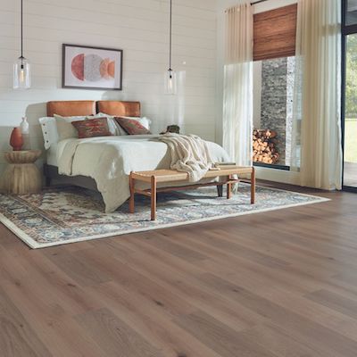 wood look laminate flooring in a bright rustic bedroom